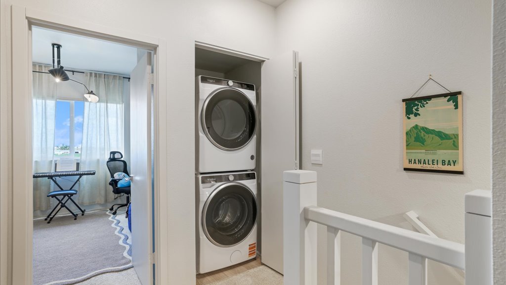 Interior hallway stairs open to laundry area