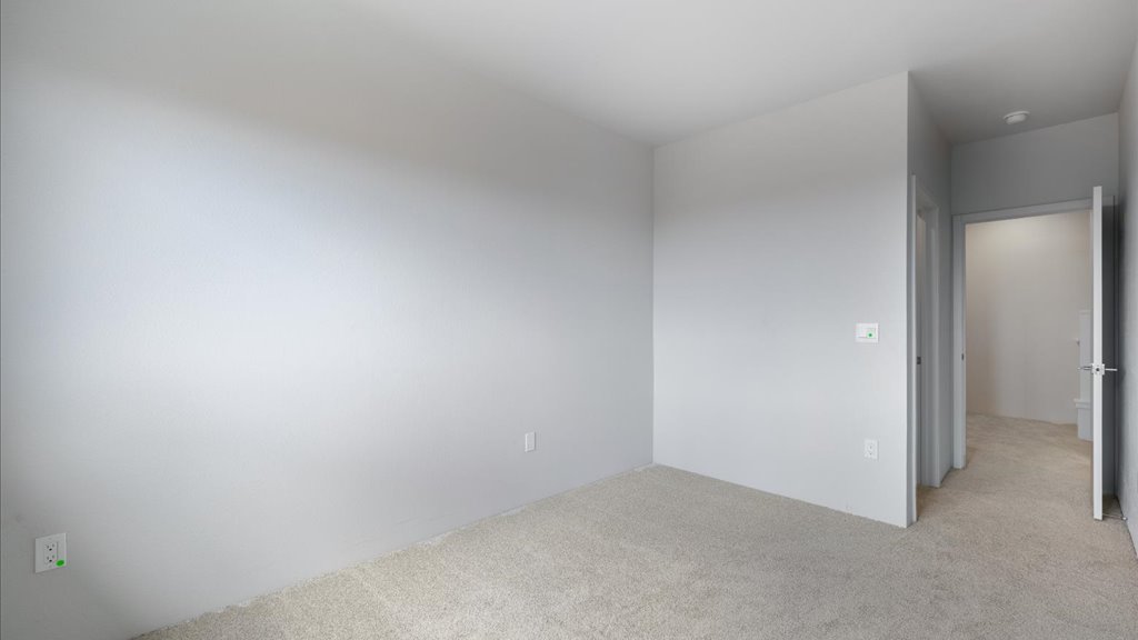 Interior bedroom with sliding closet doors