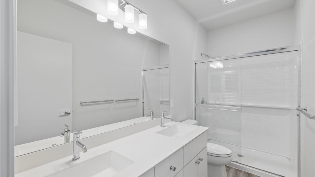 Interior bathroom with vanity and walk in shower