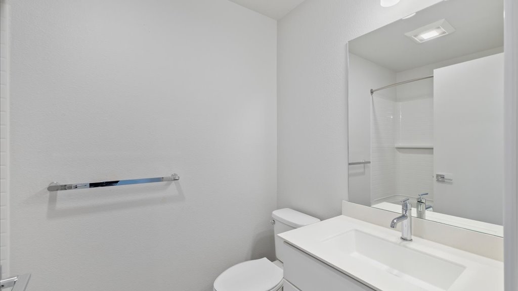 Interior bathroom with vanity toilet and shower