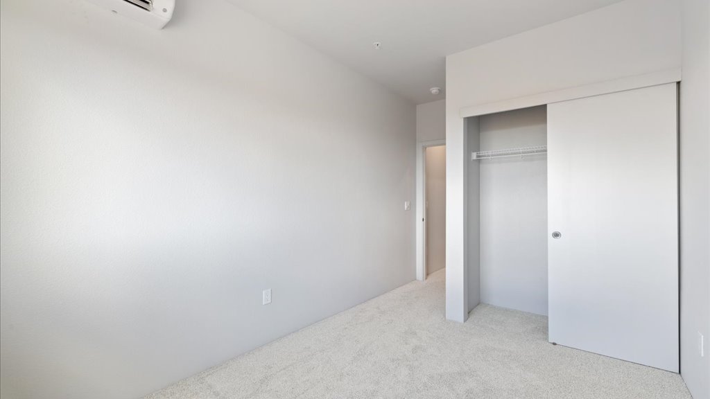 Interior bedroom with sliding closet doors