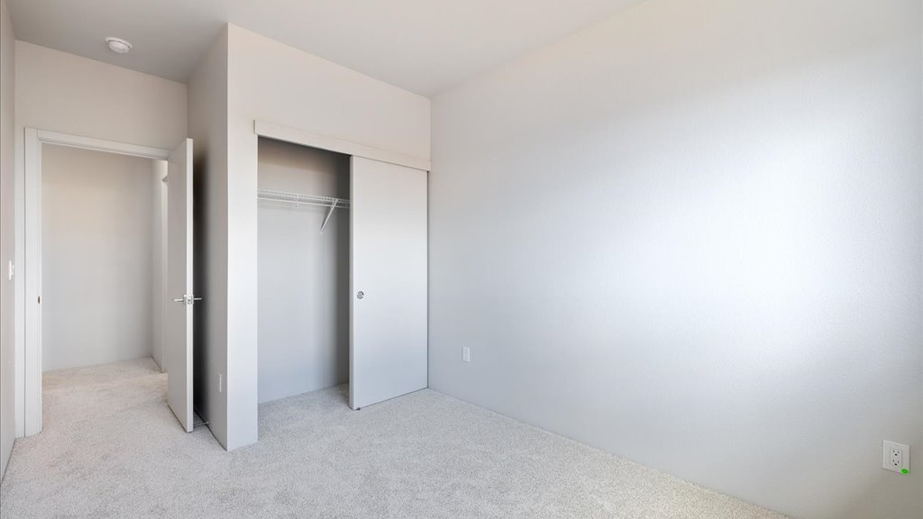 Interior bedroom with sliding closet doors