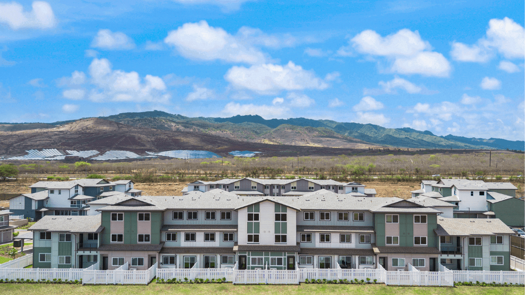 Exterior rendering three story with green and blue wood cladding and motorcross garages