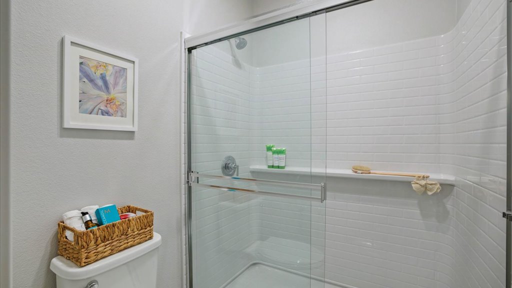 Interior bathroom with toilet vanity and walk in shower