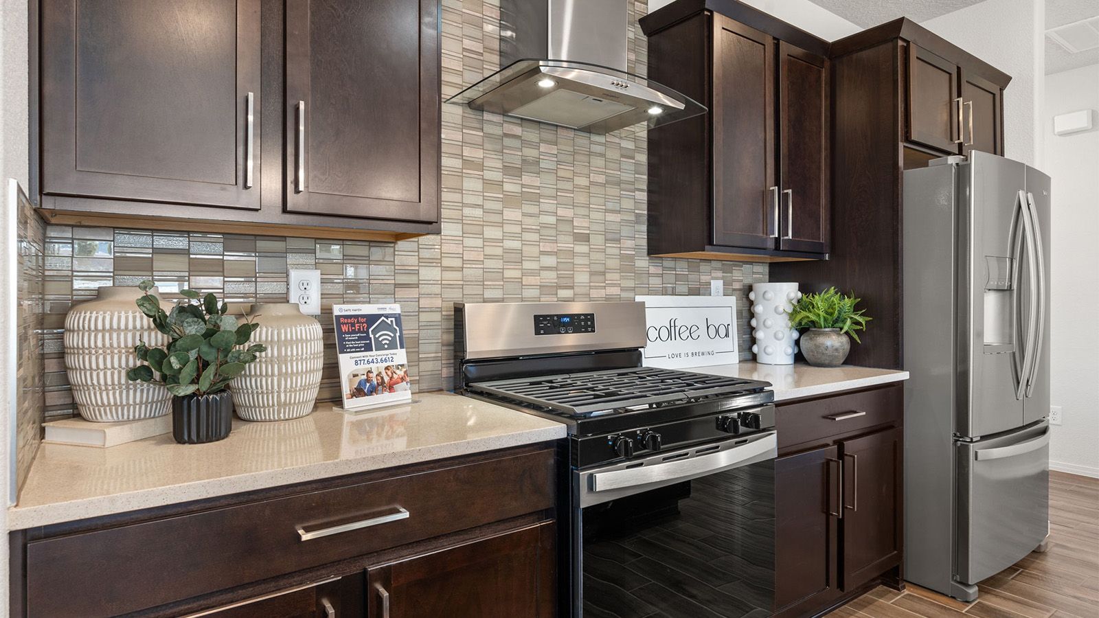 New appliance suite included with our kitchen island, sink, seating anchoring our kitchen, pantry for easy one level living