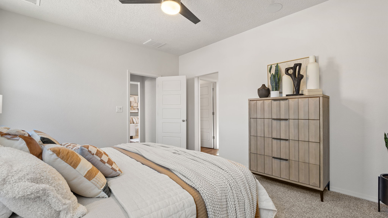 Primary bedroom designed for privacy and space with a convenient flow into spa-inspired ensuite bathroom and walk-in closet