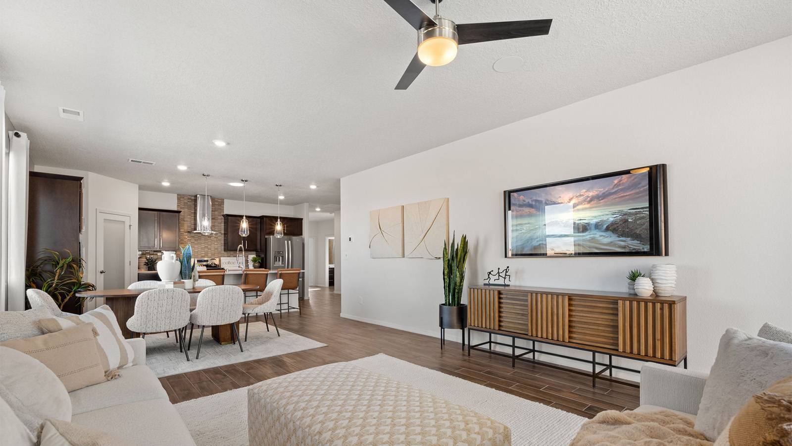 Spacious living room with view to backyard, connecting dining, kitchen and living areas at Sagrado
