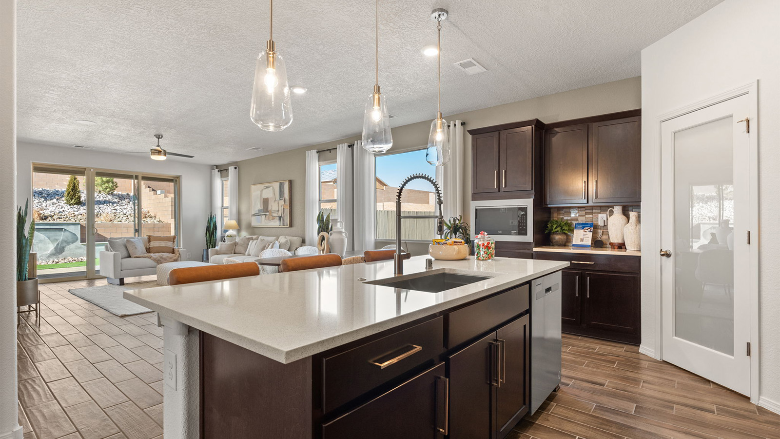 View from kitchen into the dining and living rooms with outdoor access to your patio at Sagrado
