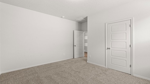 second secondary bedroom with two windows and carpet floors with closet