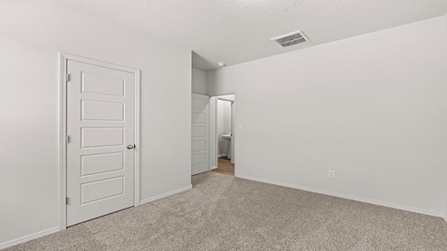 Third secondary bedroom with two windows and carpet floors with closet