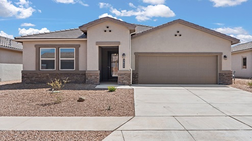 exterior sigle story home with stone accents and tile roof. 2-car garage and cement driveway