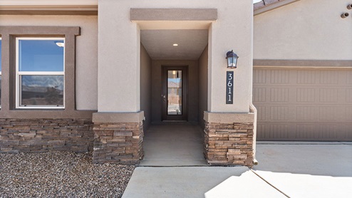 Exterior home entryway with stone accents