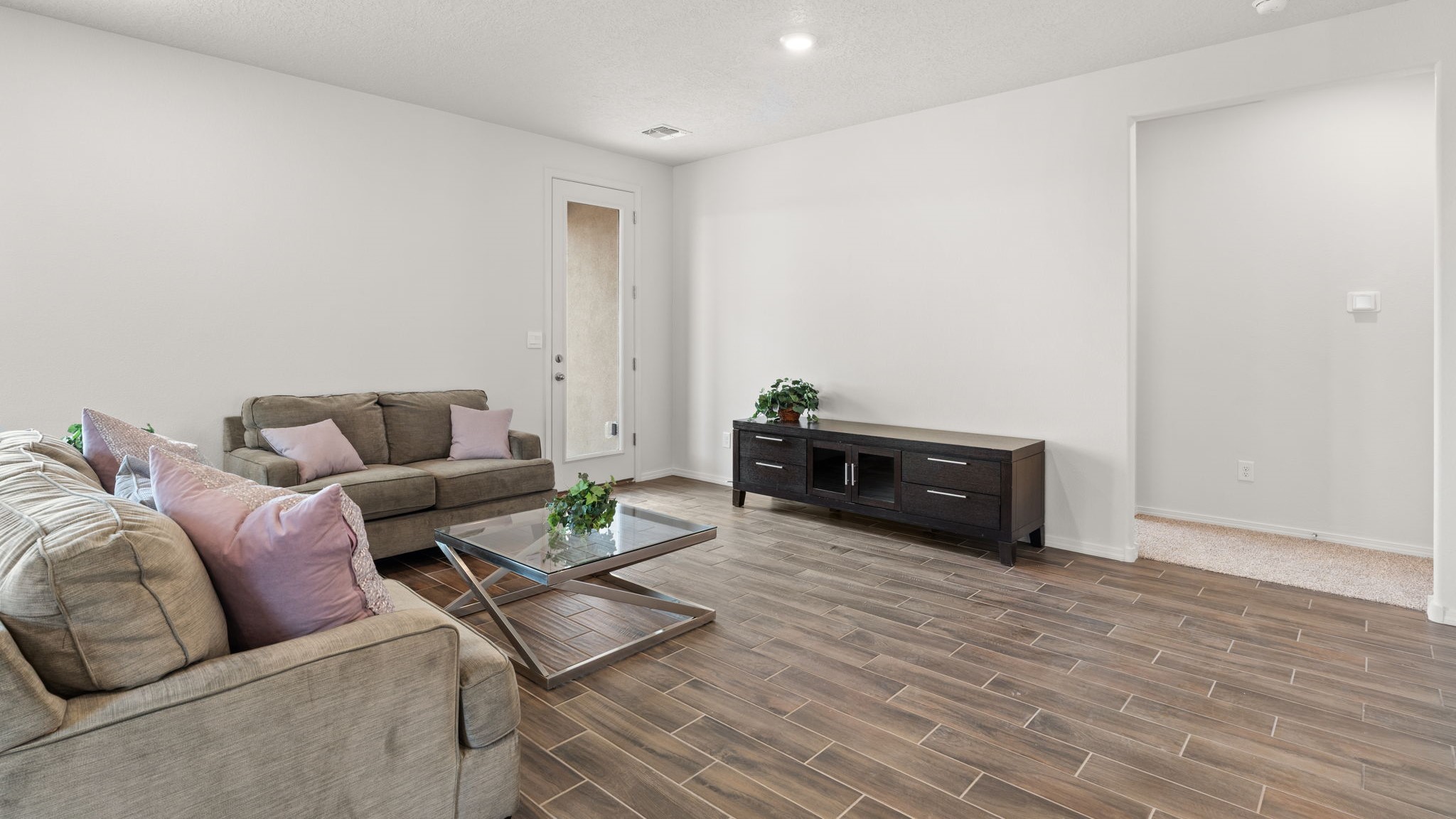 Bliss living room with ceiling fan, tile floors
