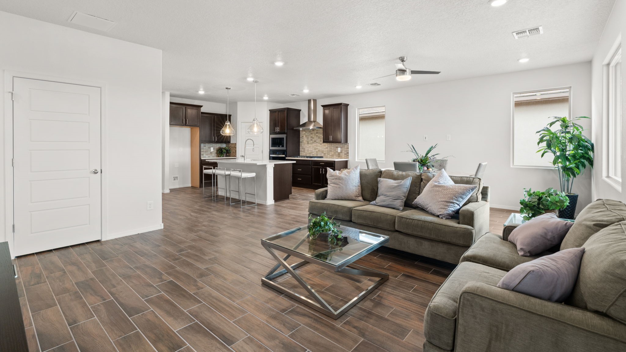 Bliss living room with ceiling fan, tile floors