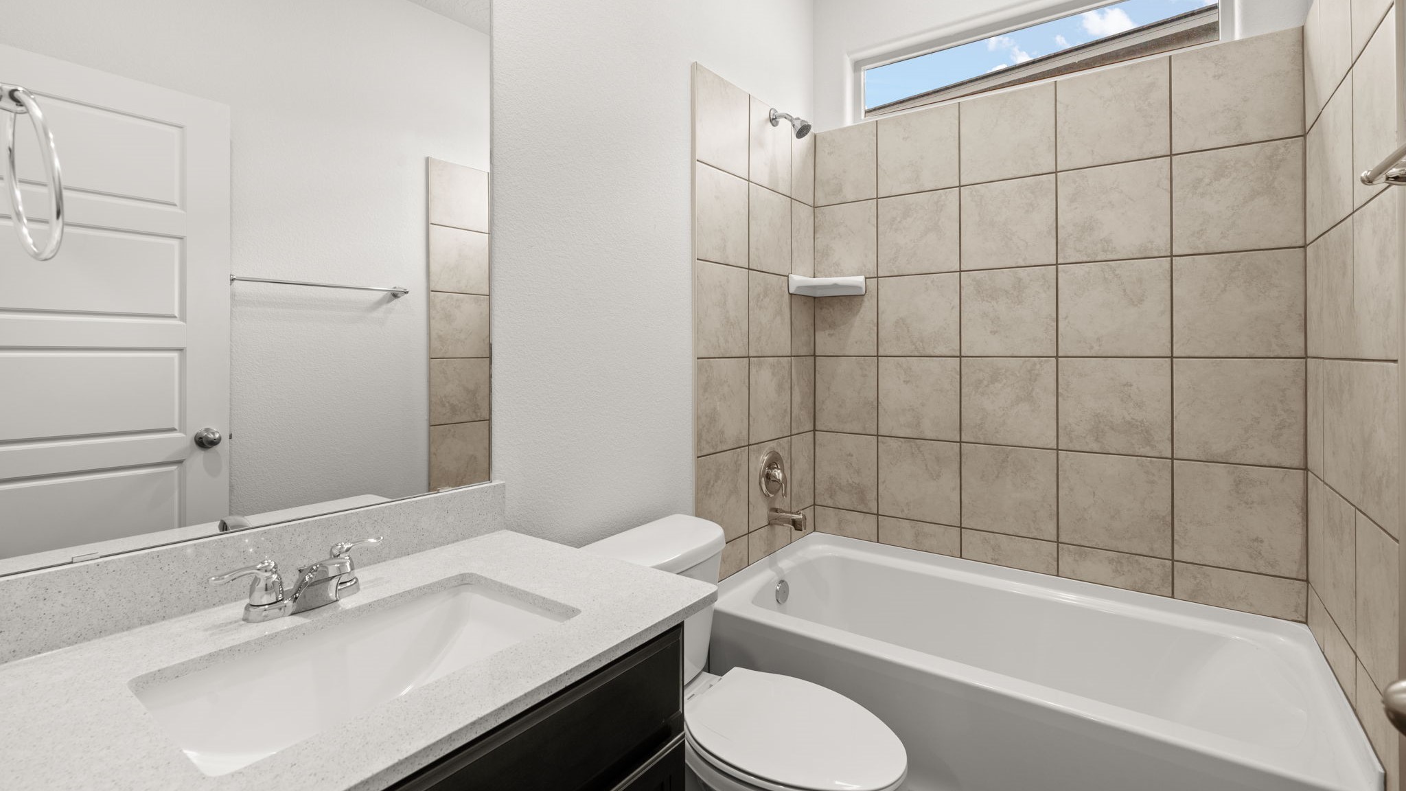 downstairs full bathroom with sink and bath shower combo