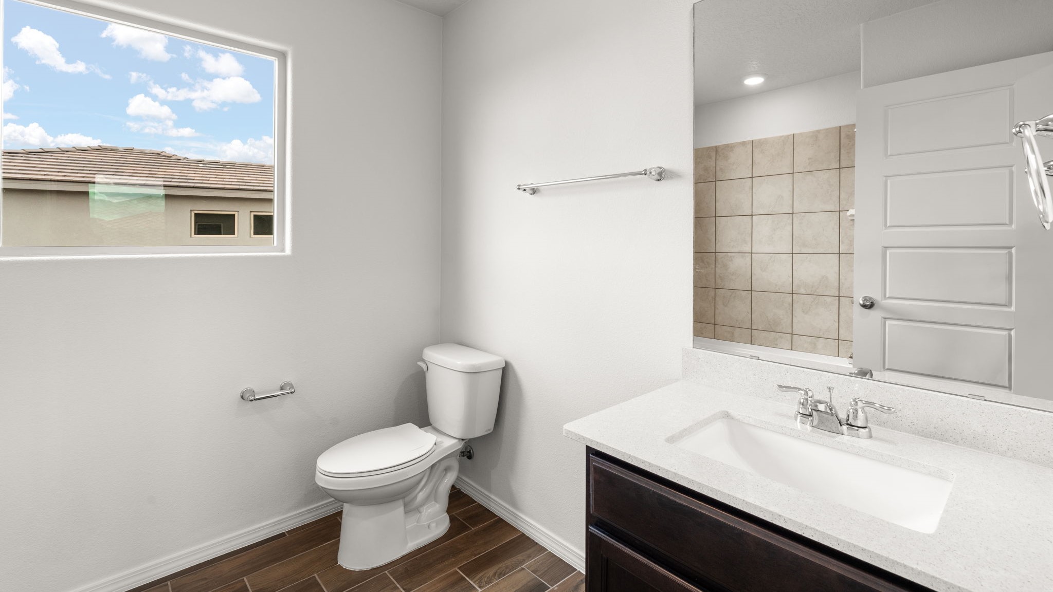 Upstairs full bathroom with sink, commode, and bath shower combo