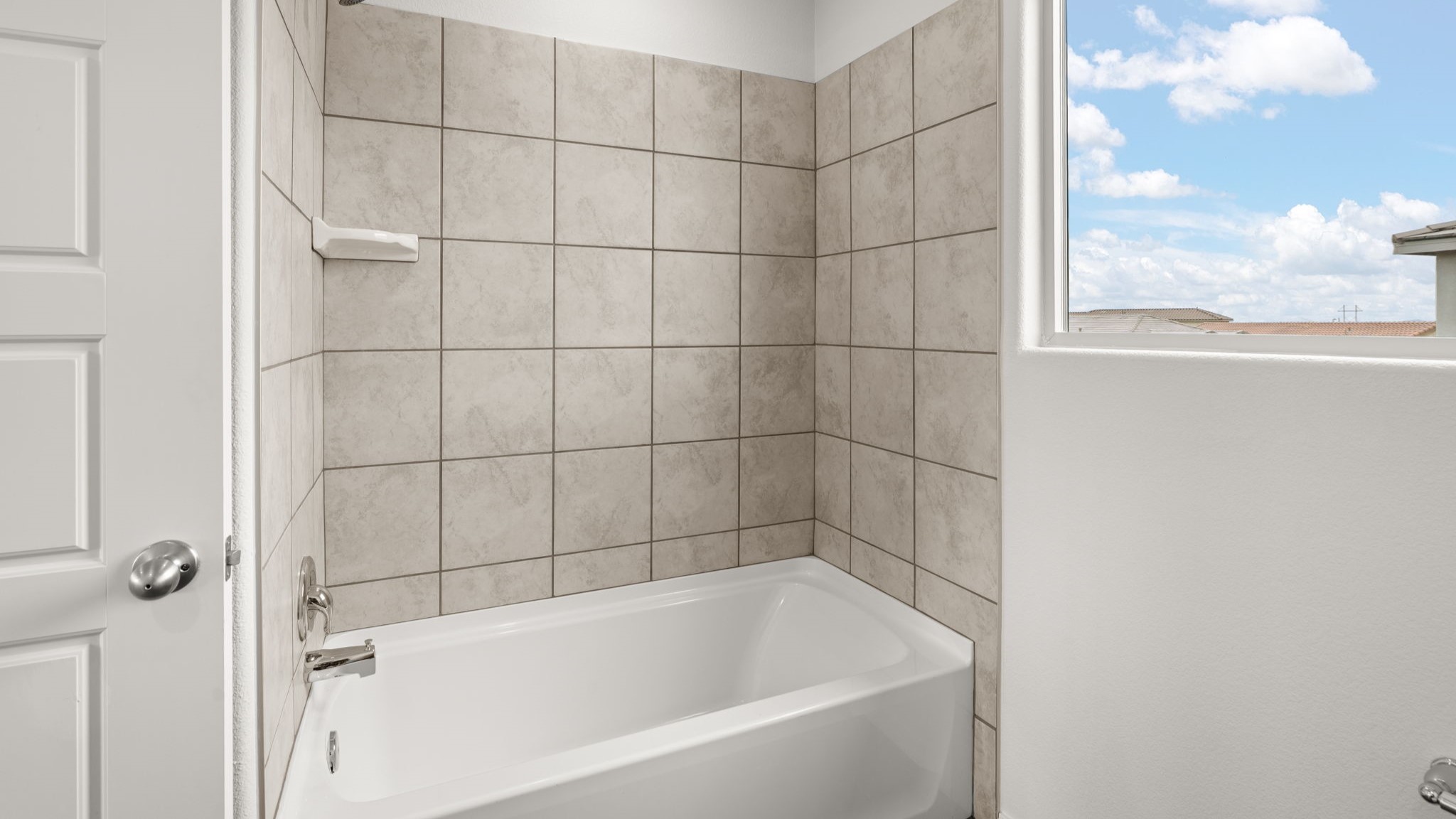 Upstairs full bathroom with sink, commode, and bath shower combo