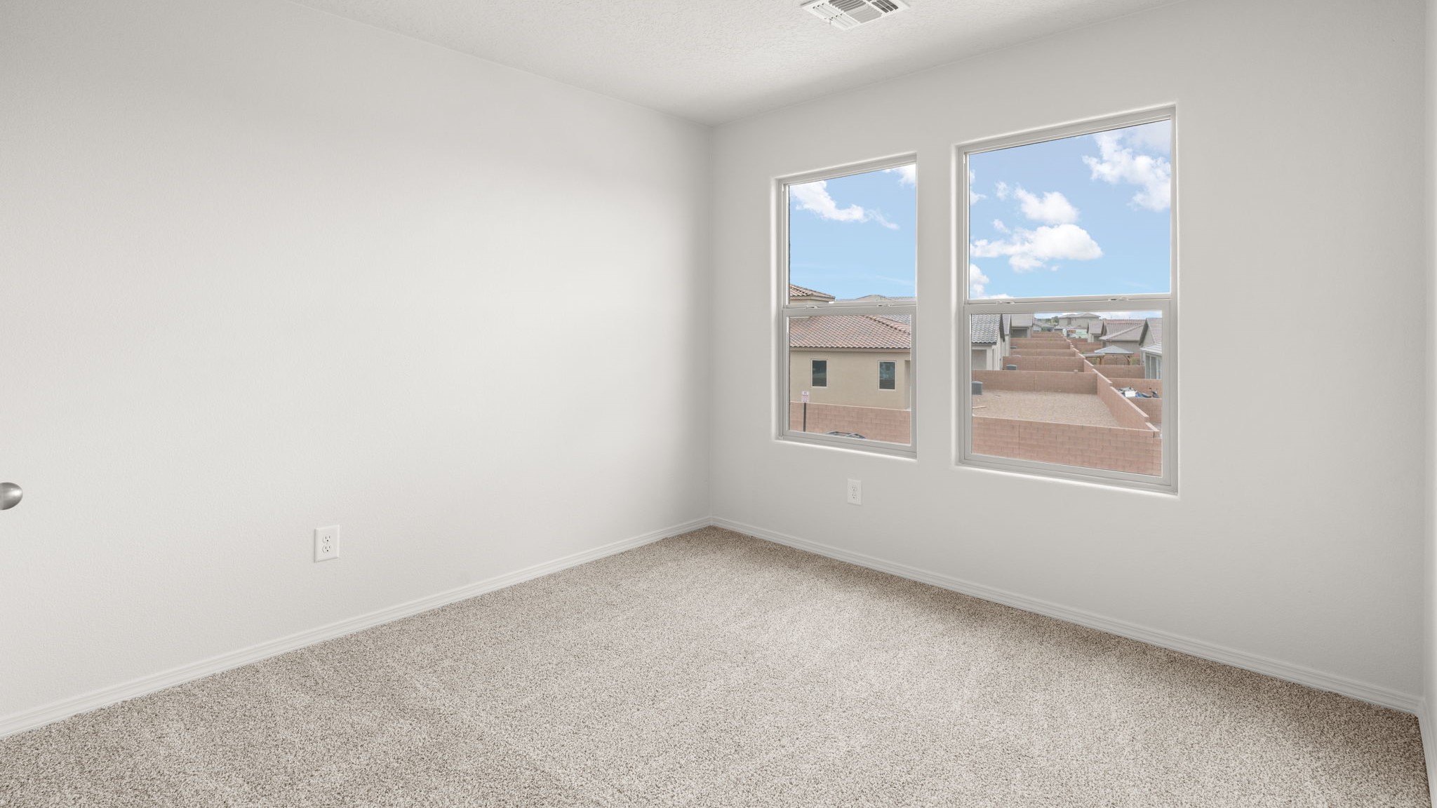Upstairs Bedroom 3 with carpet, closet and two windows