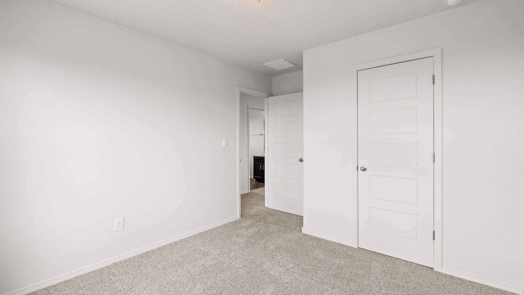 Upstairs Bedroom 3 with carpet, closet and two windows