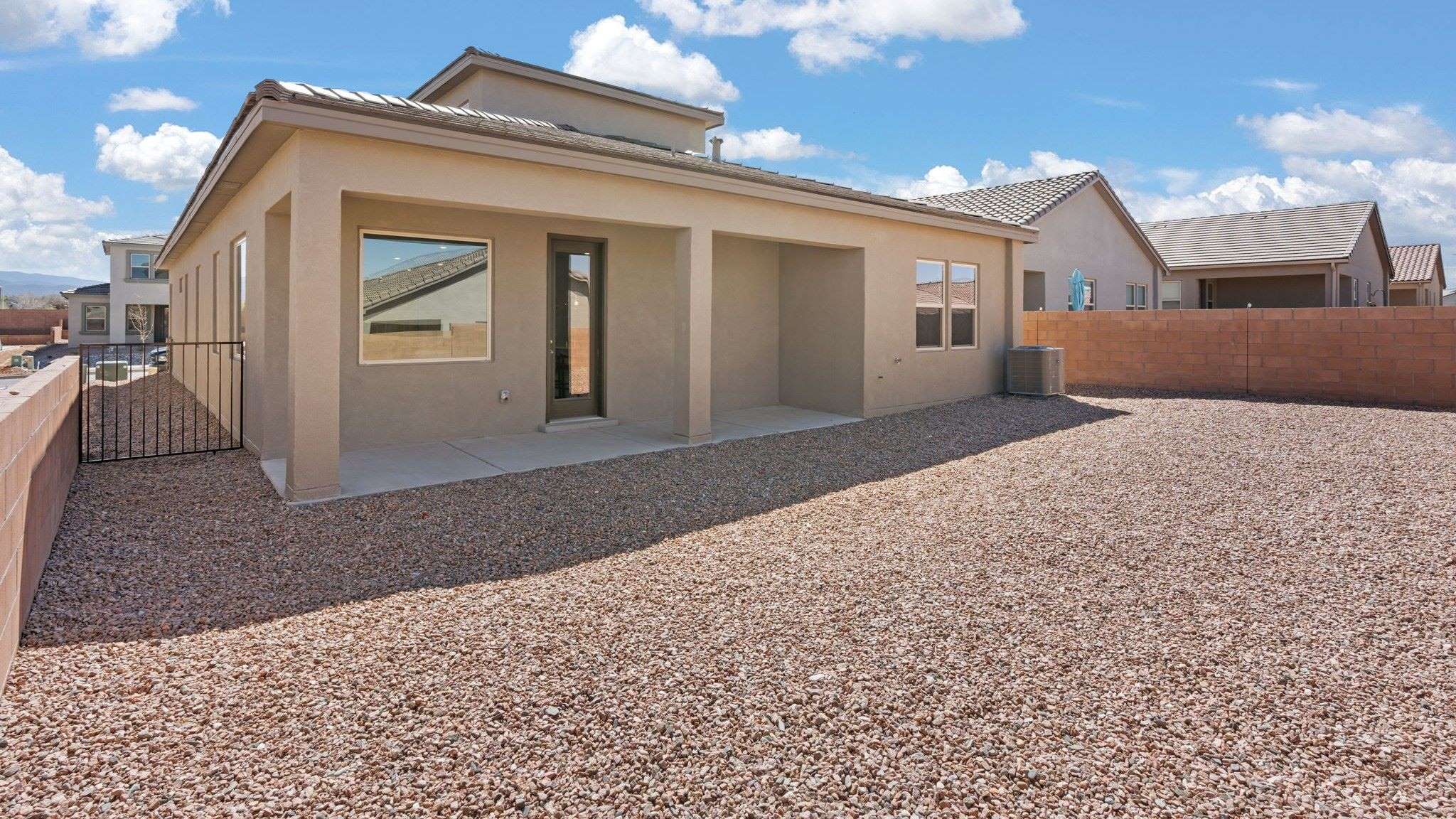 melody outside backyard with covered patio