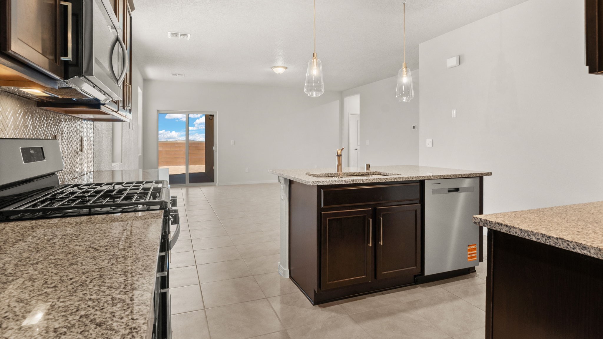 Kitchen appliance suite included with stainless steel selections and white cabinetry at Vista Grande