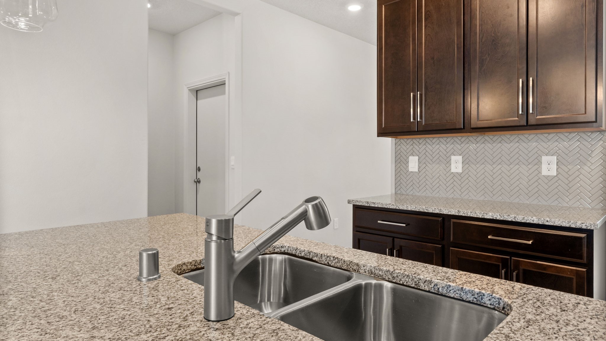 Kitchen appliance suite included with modern design elements, ample storage and functional layout at Vista Grande