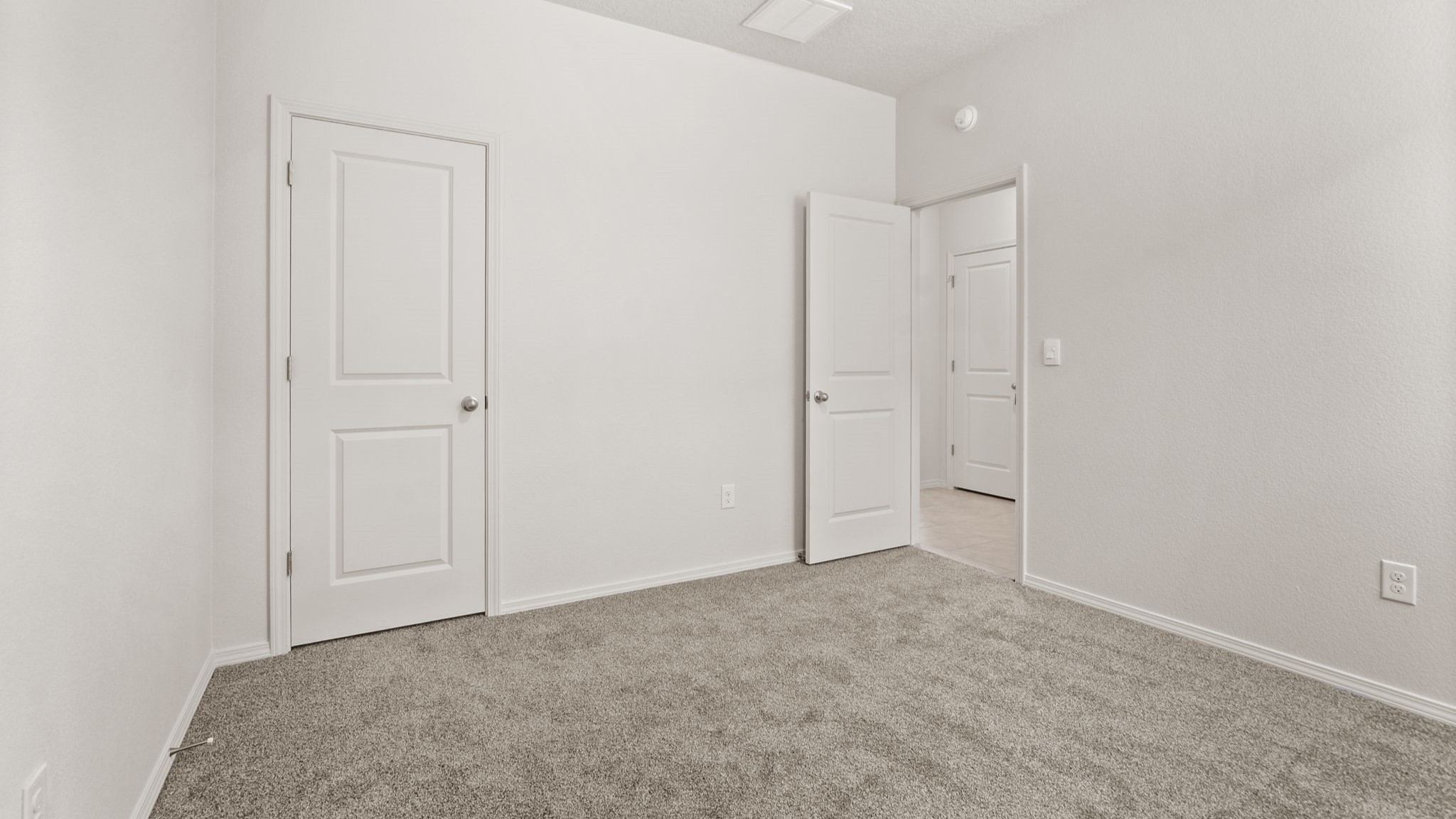 Bedroom two designed for flexible use such as guest space, study, or hobby room at Vista Grande