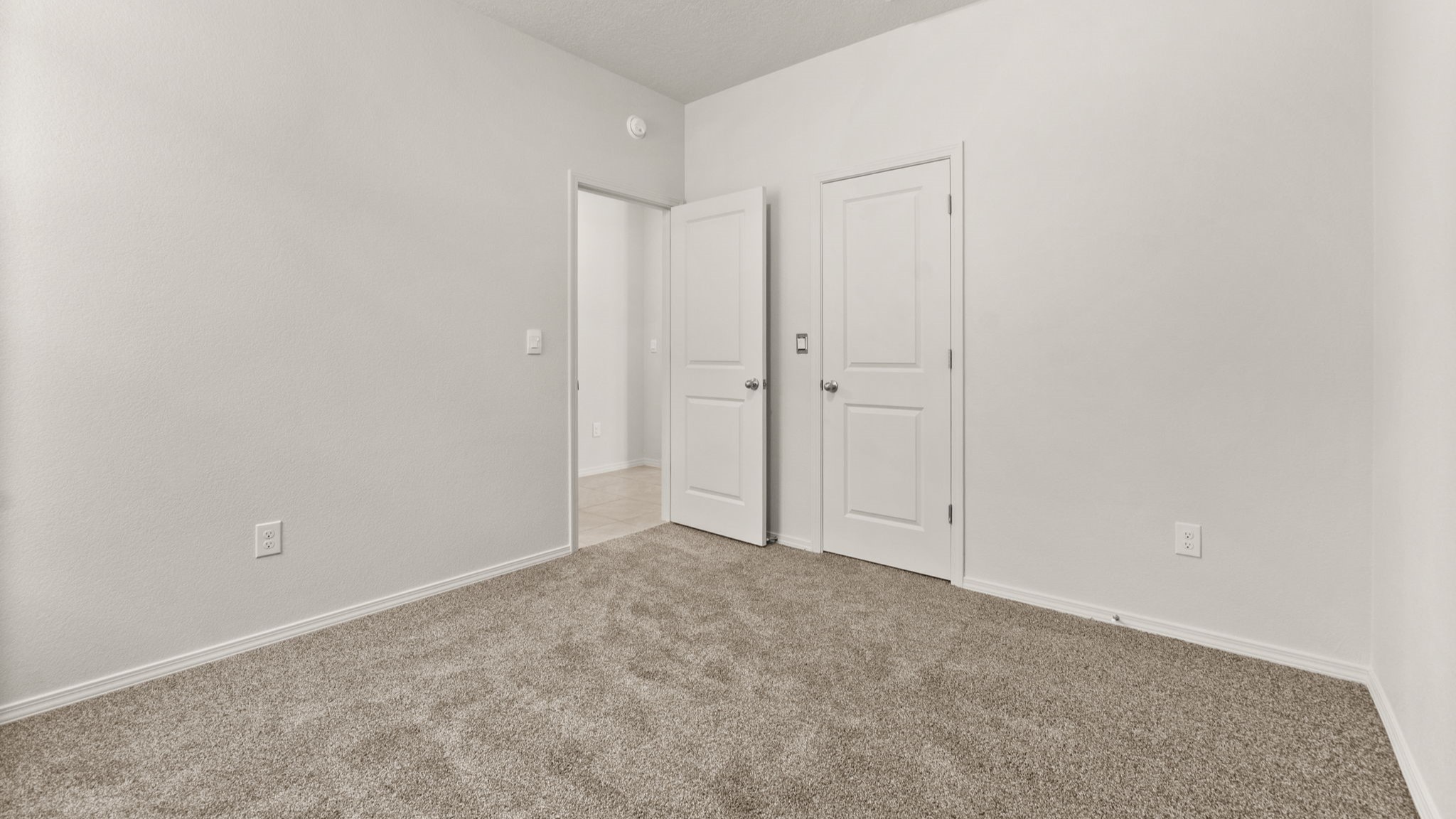 Primary bedroom offering natural light and room for a full bedroom arrangement at Vista Grande