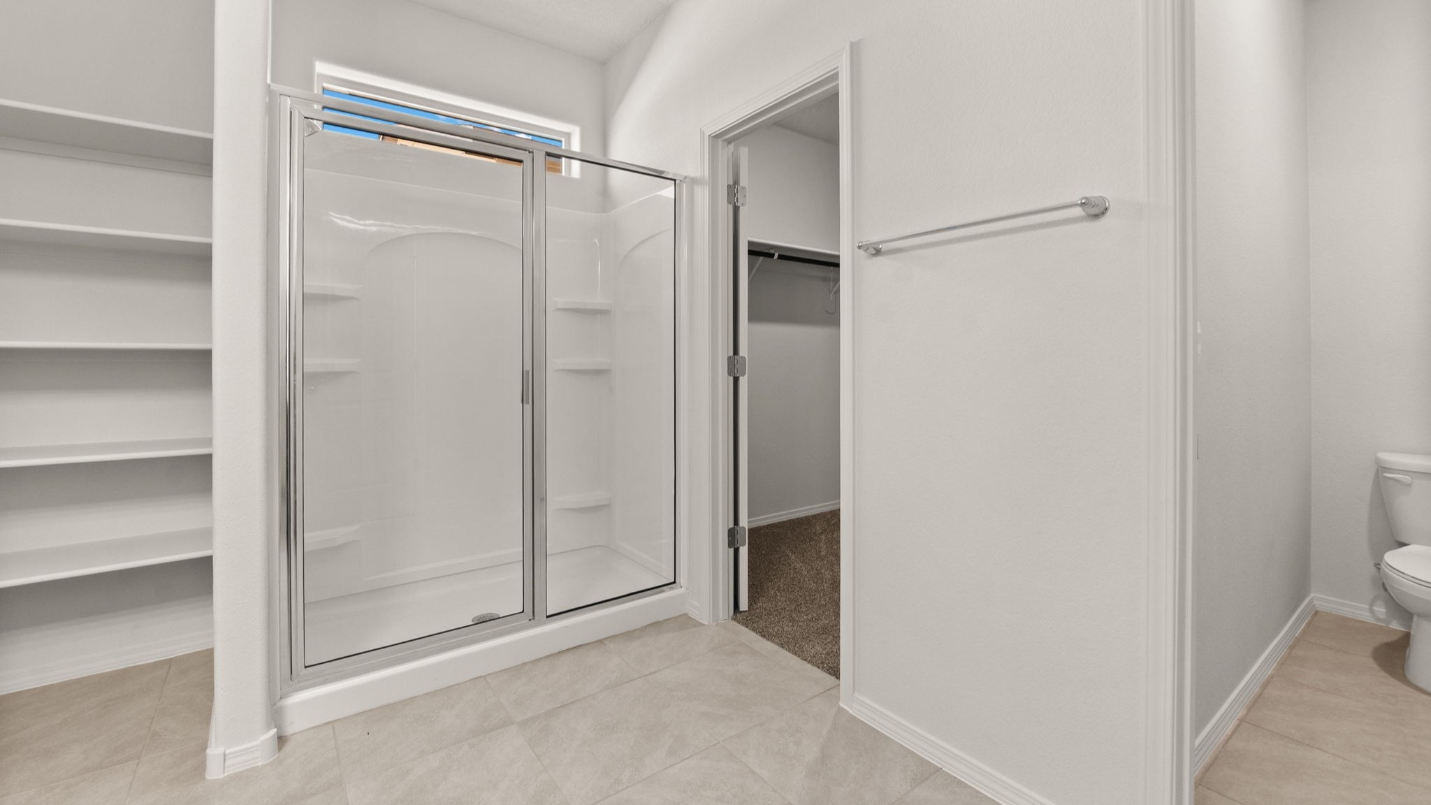 Ensuite owner’s bathroom with bright finishes, walk-in shower, and generous vanity space at Vista Grande