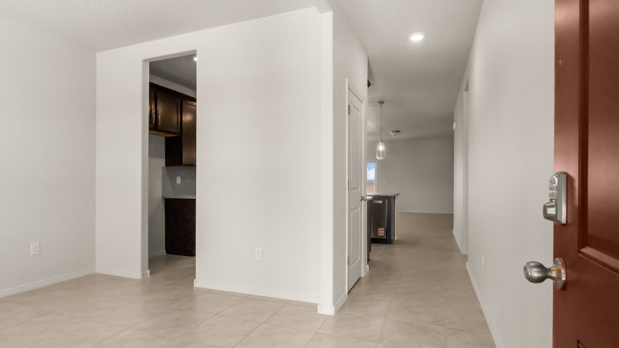 Foyer with modern lighting and clean lines leading into the main living area at Vista Grande