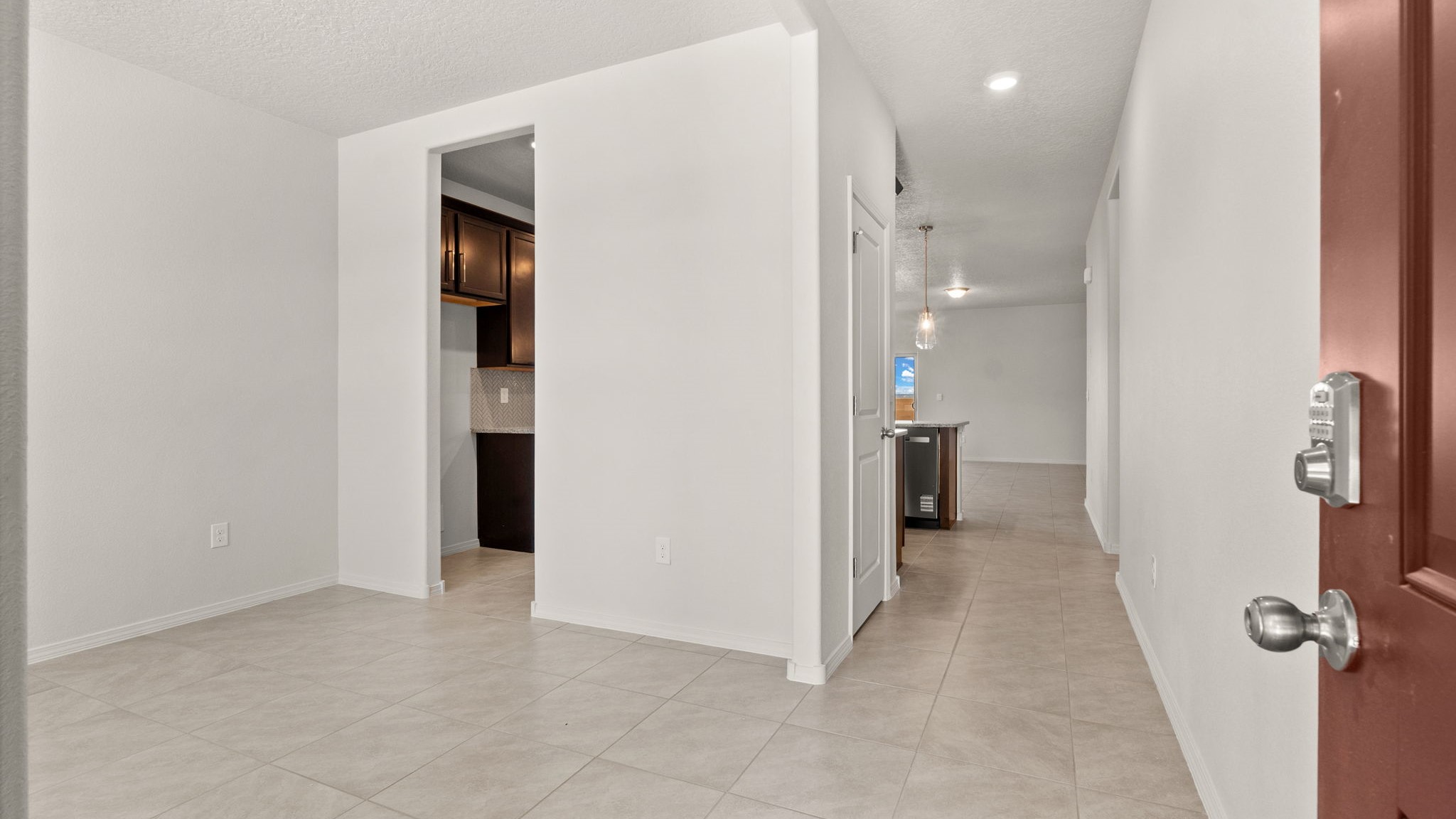 Front hall leading from the entry porch to open concept living and flex spaces at Vista Grande