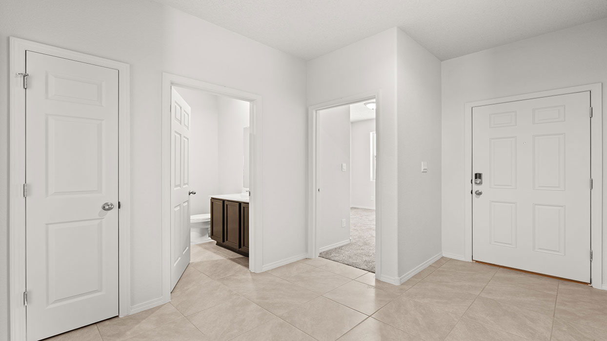 Front entryway showing doors with secondary bedroom and bathroom
