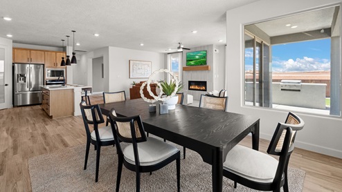 the destin dining room with tile floors and window overlooking backyard