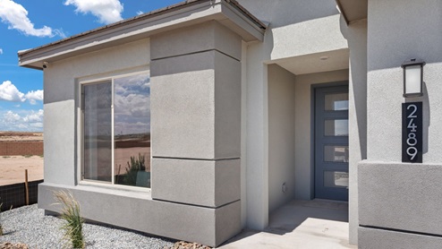 The Destin Model with blue accents modern exterior