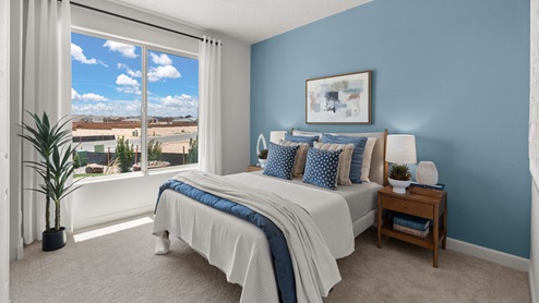 Bedroom 3 in front of home with two windows and closet with sliding doors