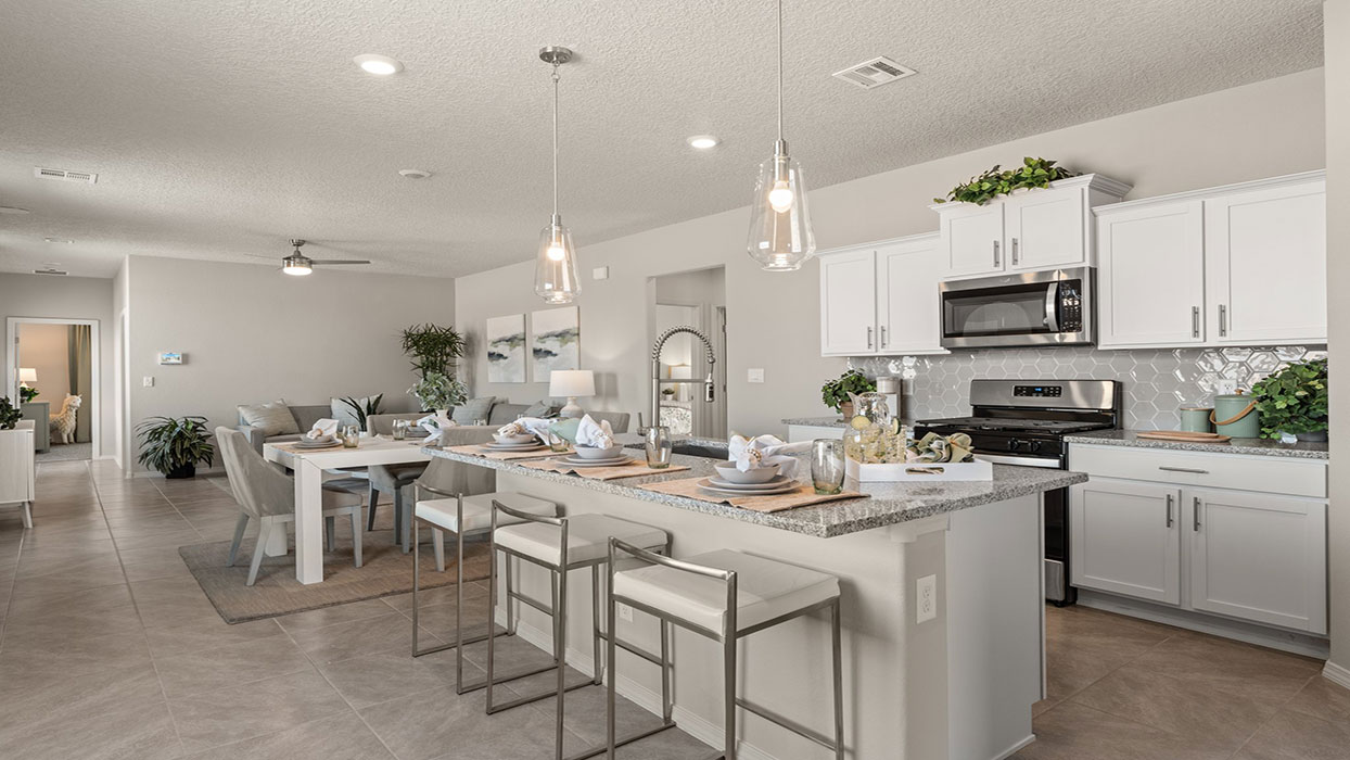 Kitchen looking to dining and living areas showing clean layout and integrated design at Los Diamantes Phase III