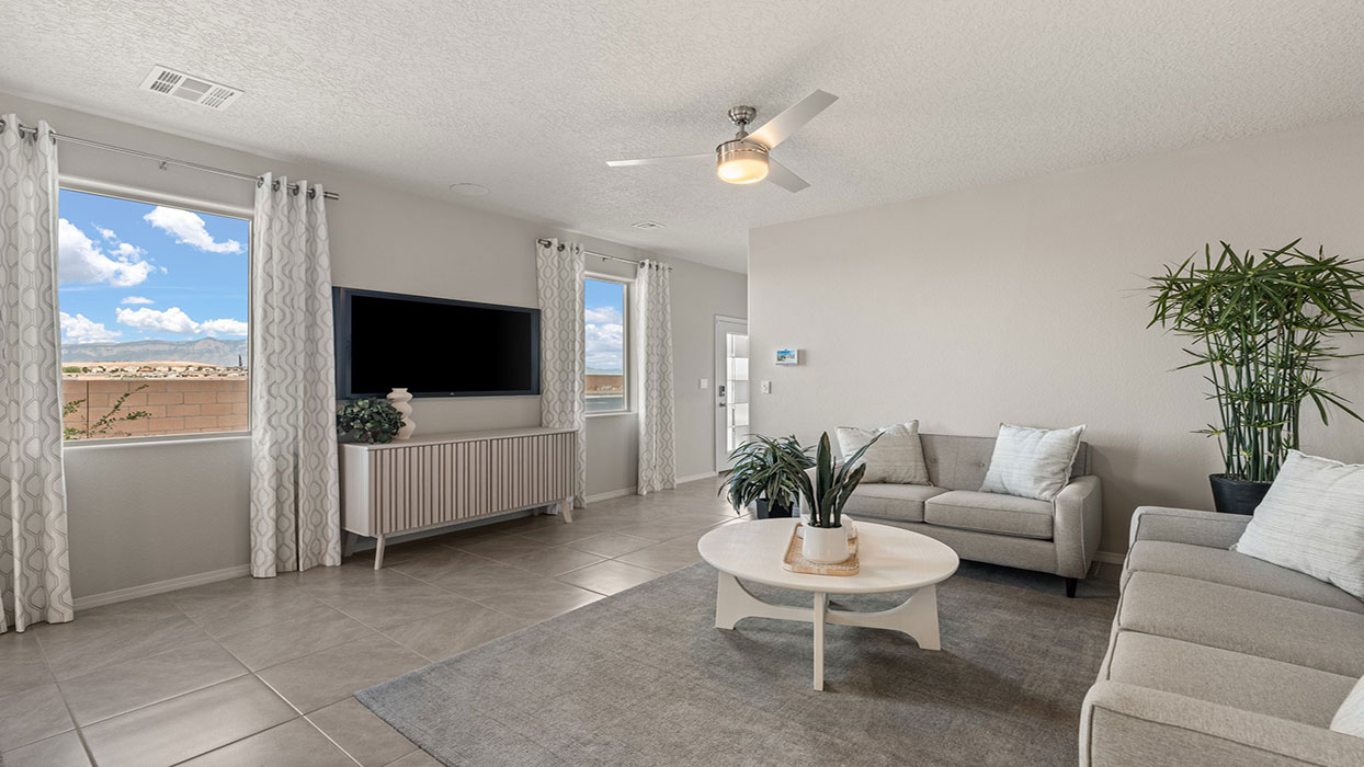 Dining room looking into living room with access to outdoor space and gathering areas at Los Diamantes Phase III