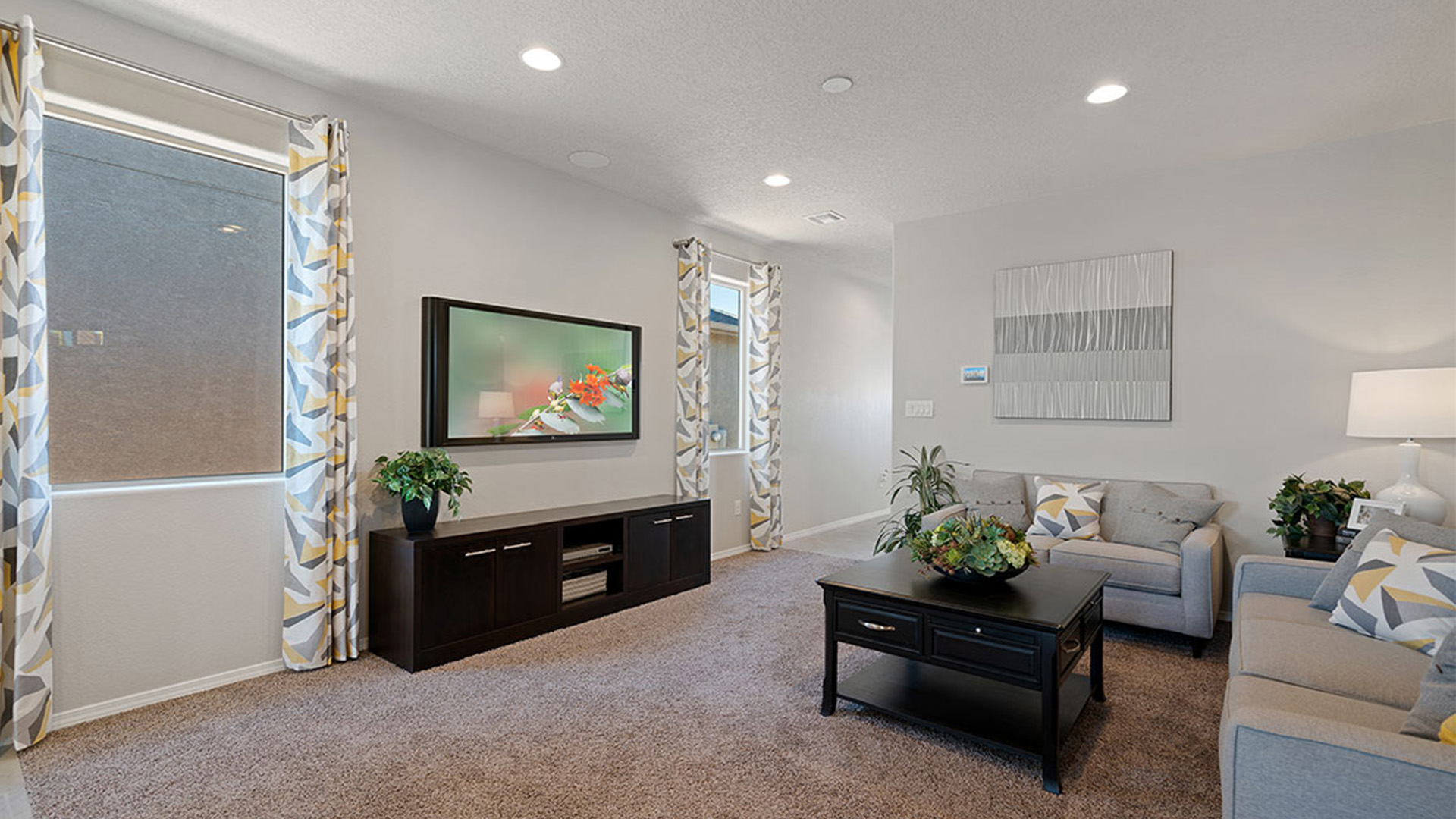 Living room showing open layout connecting to dining and kitchen areas at Los Diamantes Phase III