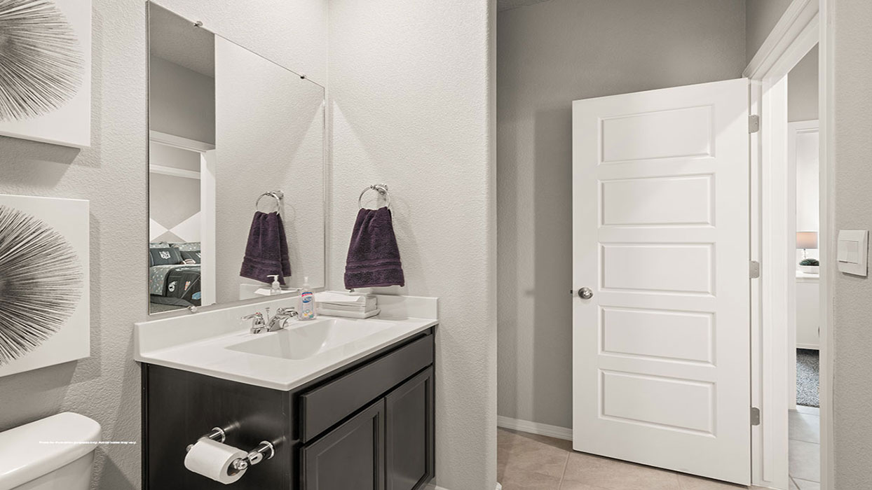 Full bathroom 2 with vanity, mirror, fixtures, cabinets, and tub-shower combo at Los Diamantes Phase III