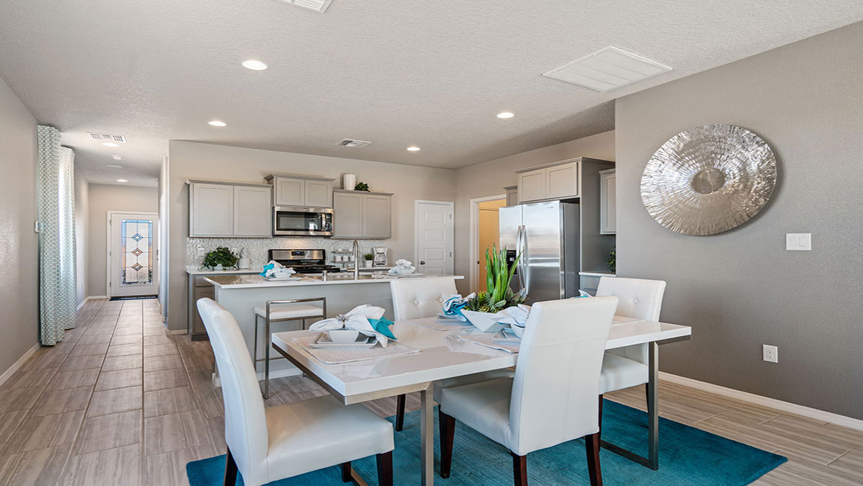 View from living room to kitchen and dining areas, display open concept at Vista Grande