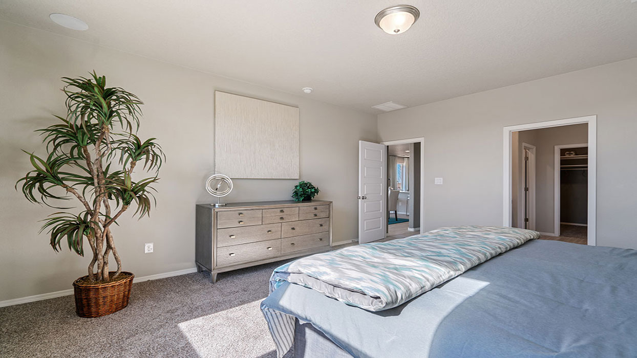 Primary bedroom offering natural light and room for a full bedroom arrangement at Vista Grande