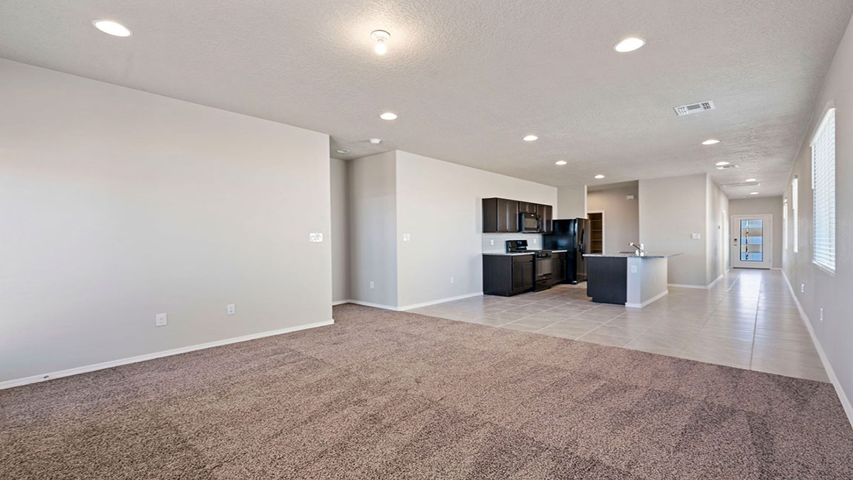 View from kitchen to the living, dining and backyard areas, delivering our fresh open design at Fiesta Del Norte