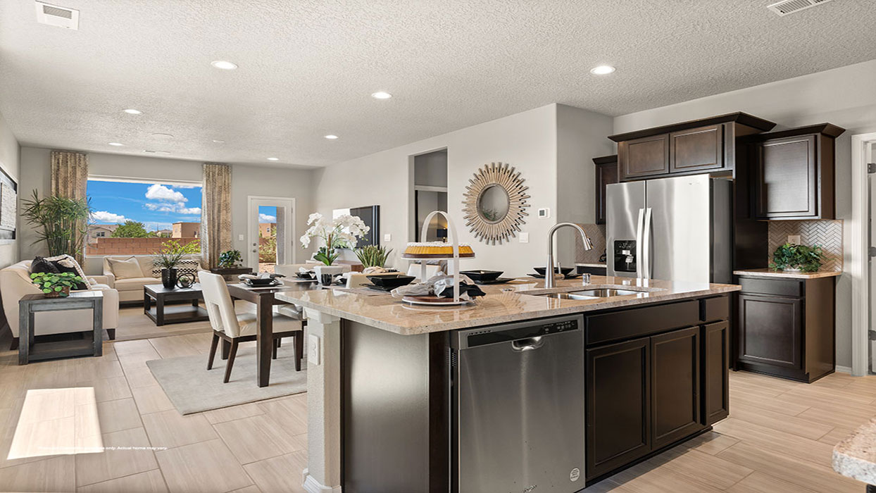 Interior kitchen with center island and dark brown cabinets