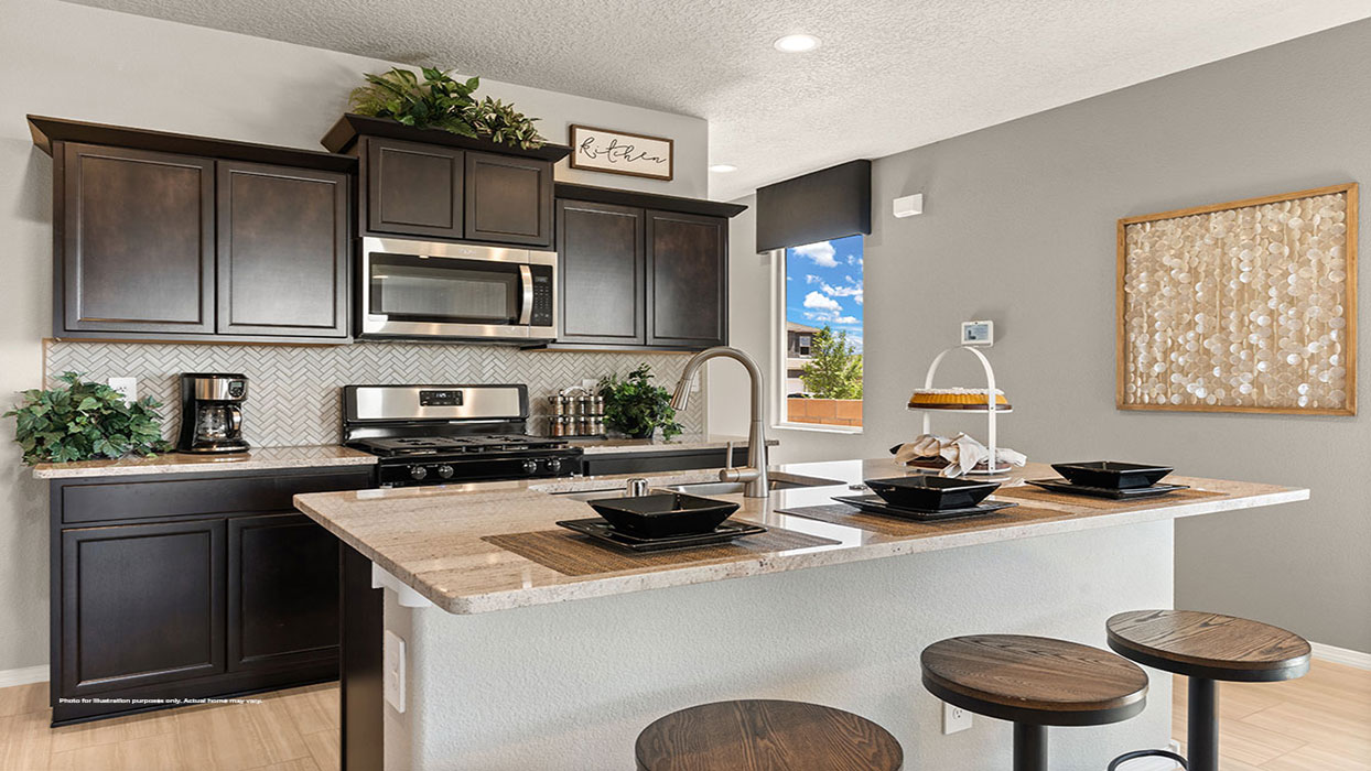 Interior kitchen with center island and dark brown cabinets