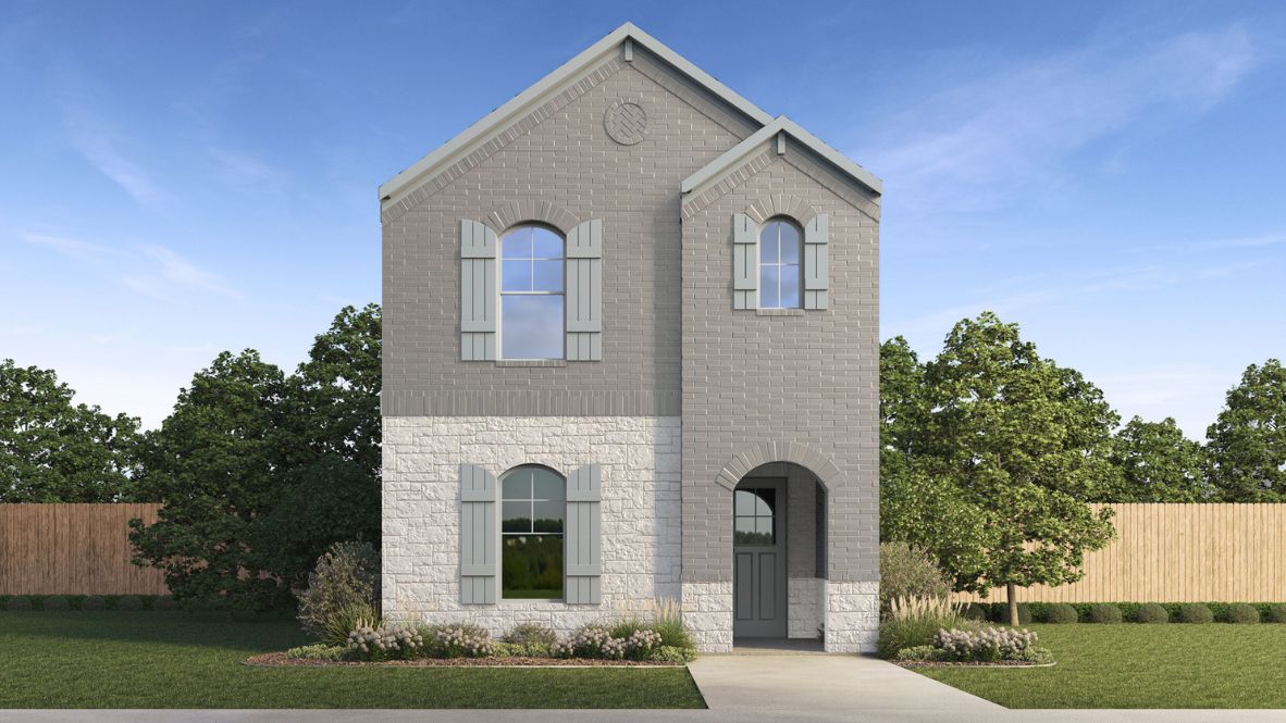 Two story new build home with stone and clean landscaping.