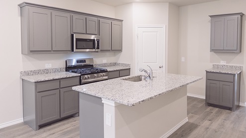 Kitchen with gray cabinets and island