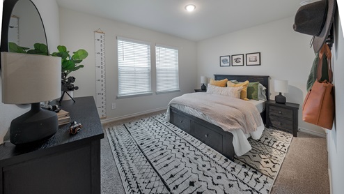 Interior bedroom with two large windows