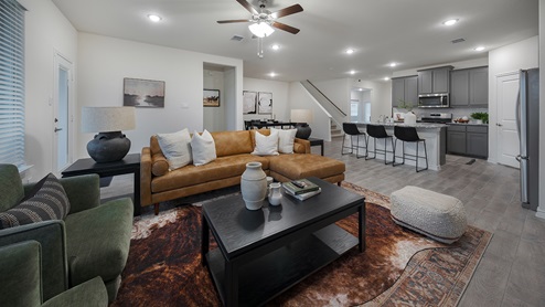 Interior living room open to kitchen and dining area