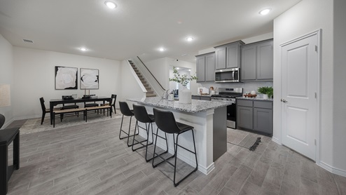 Interior kitchen with grey cabinets and large island