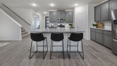 Interior kitchen with grey cabinets and large island